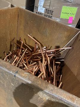 Copper Pipes in Recycling Bin at Scrap Metal Facility