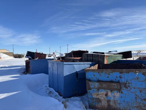 Scrap Metal Bins in Snow at Recycling Facility