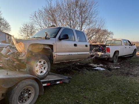"Scrap Metal Recycling: Old Truck Being Transported for Salvage"